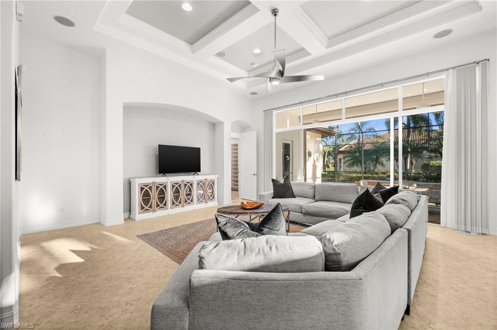 12553 Grandezza Circle Estero, FL 33928 - Photo 5 of 46 a living room with furniture a flat screen tv and a large window