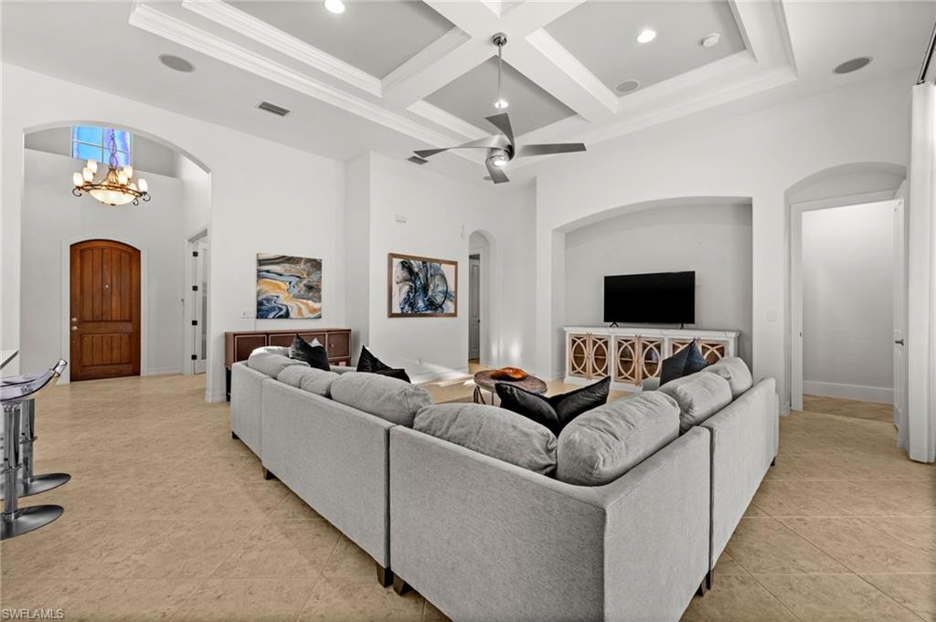 12553 Grandezza Circle Estero, FL 33928 - Photo 8 of 46 a living room with furniture and a flat screen tv