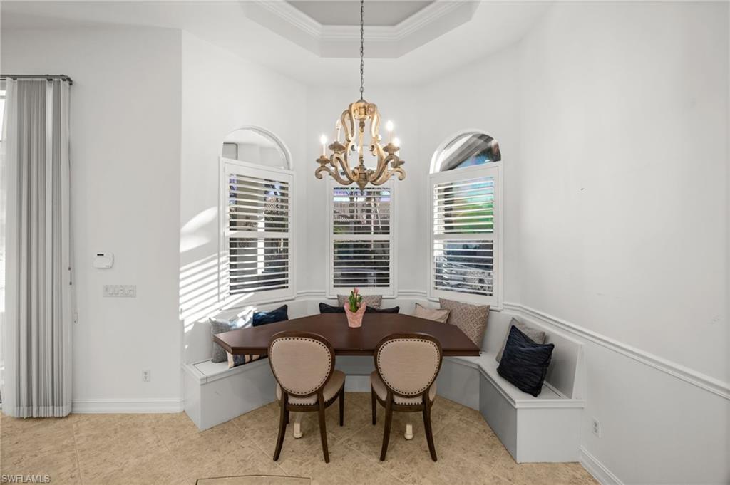 12553 Grandezza Circle Estero, FL 33928 - Photo 9 of 46 a view of a dining room with furniture and window