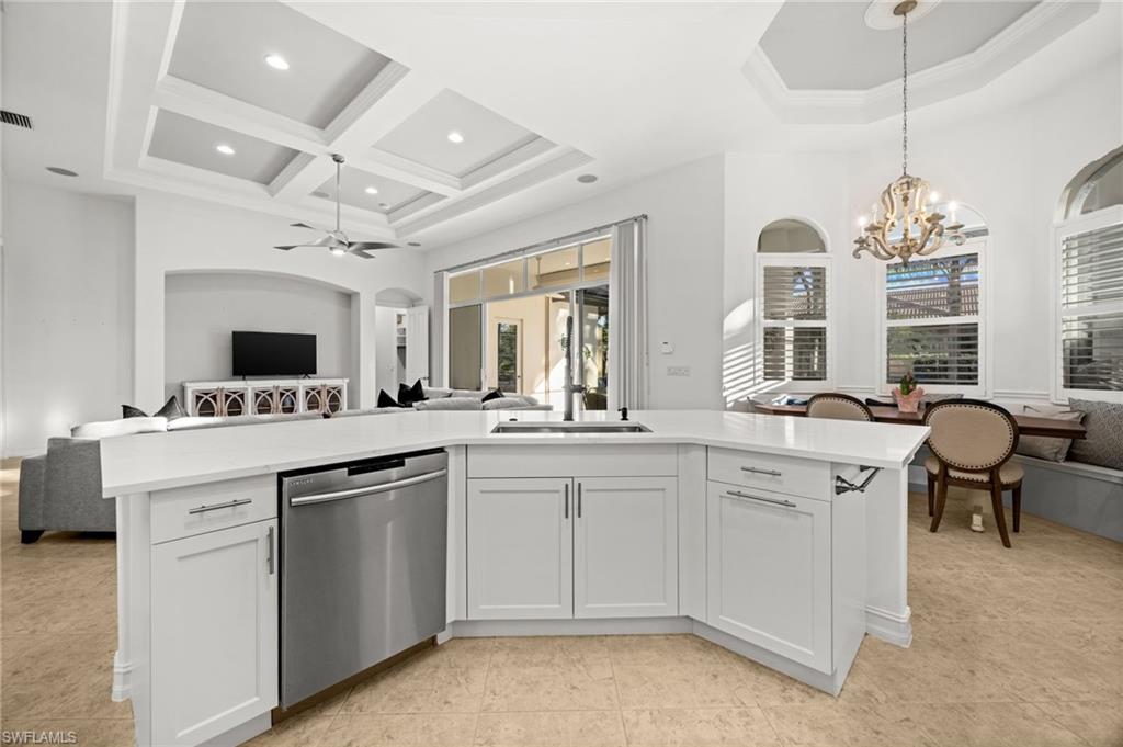 12553 Grandezza Circle Estero, FL 33928 - Photo 10 of 46 a kitchen with a sink and stove