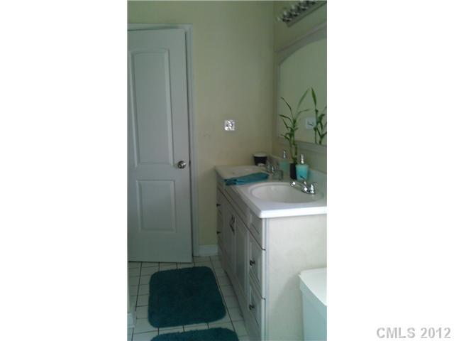804 Deese Road Monroe, NC 28110 - Photo 14 of 16 a bathroom with a sink and a mirror