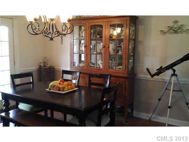 804 Deese Road Monroe, NC 28110 - Photo 7 of 16 a kitchen with a table and chairs in it