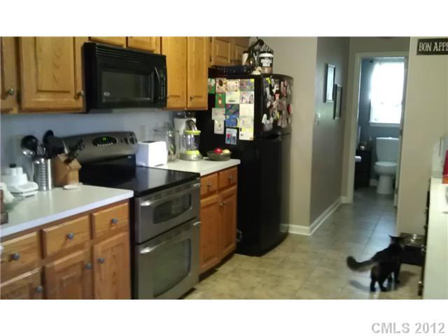 804 Deese Road Monroe, NC 28110 - Photo 8 of 16 a kitchen with a sink cabinets and appliances