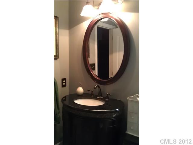 804 Deese Road Monroe, NC 28110 - Photo 10 of 16 a bathroom with a sink and a mirror