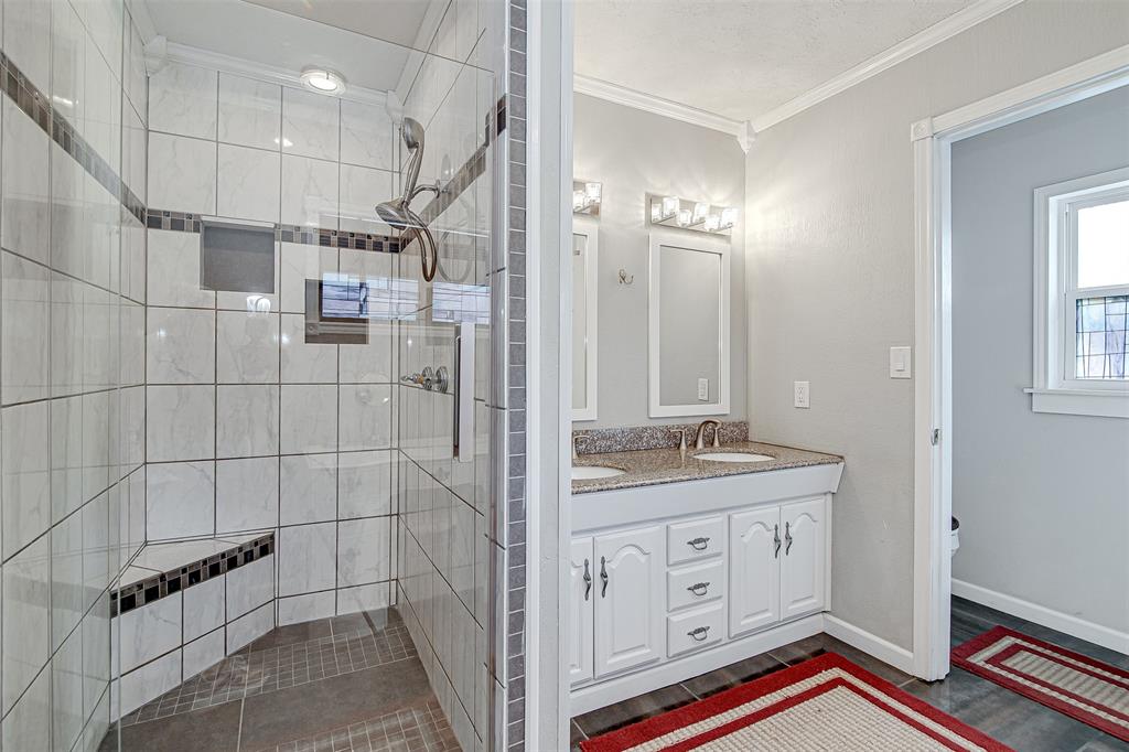2521 Timber Road Burleson, TX 76028 - Photo 11 of 34 a spacious bathroom with a double vanity sink a mirror and a shower