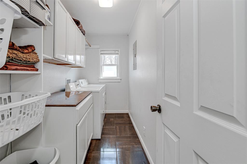 2521 Timber Road Burleson, TX 76028 - Photo 14 of 34 a utility room with a sink a washer and dryer