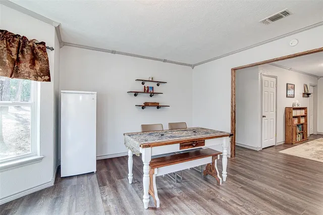 a kitchen with stainless steel appliances granite countertop a stove and cabinets