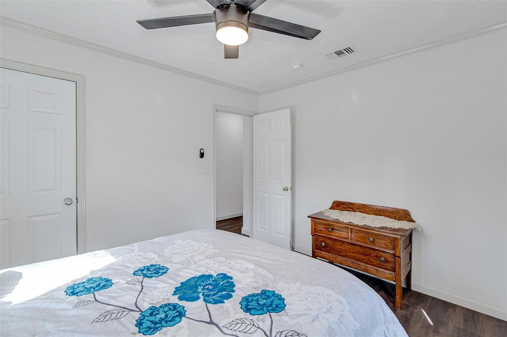 2521 Timber Road Burleson, TX 76028 - Photo 25 of 34 a bedroom with a bed and a dresser