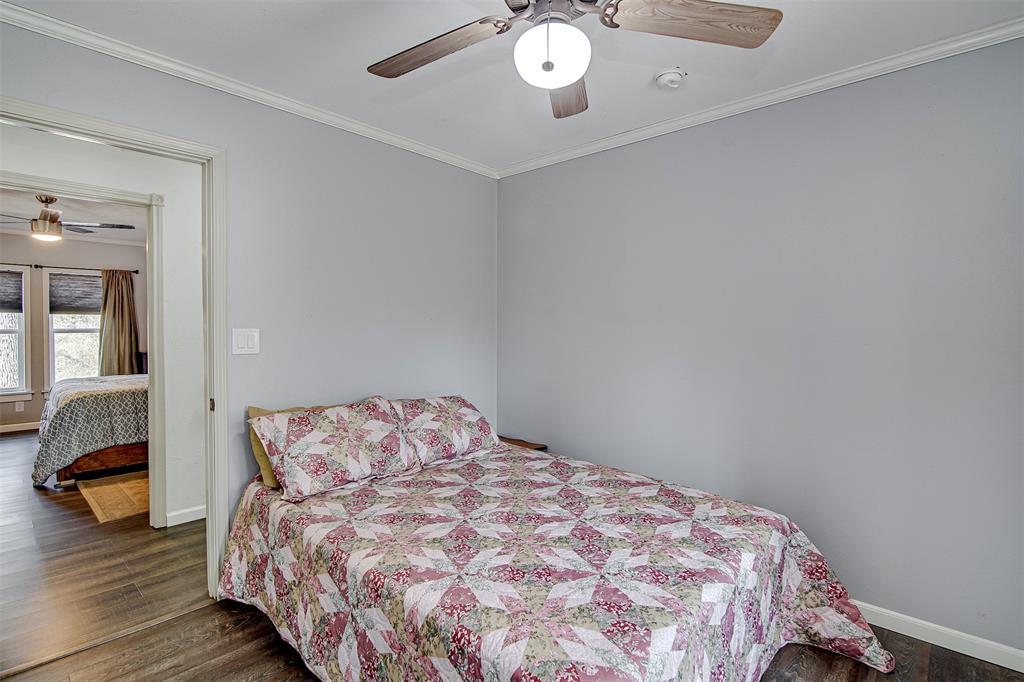 2521 Timber Road Burleson, TX 76028 - Photo 26 of 34 a bedroom with a bed and wooden floor