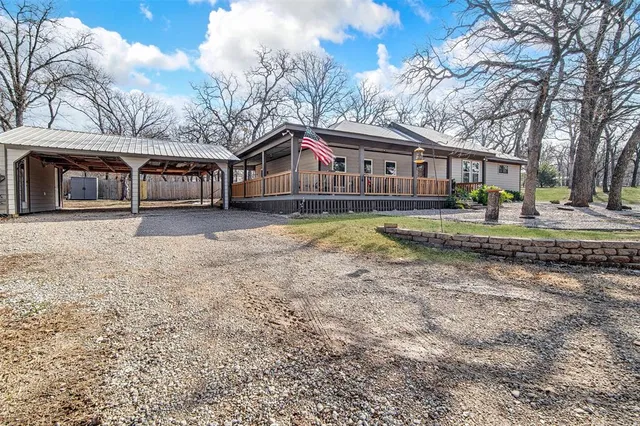a view of a house with a snow in the yard