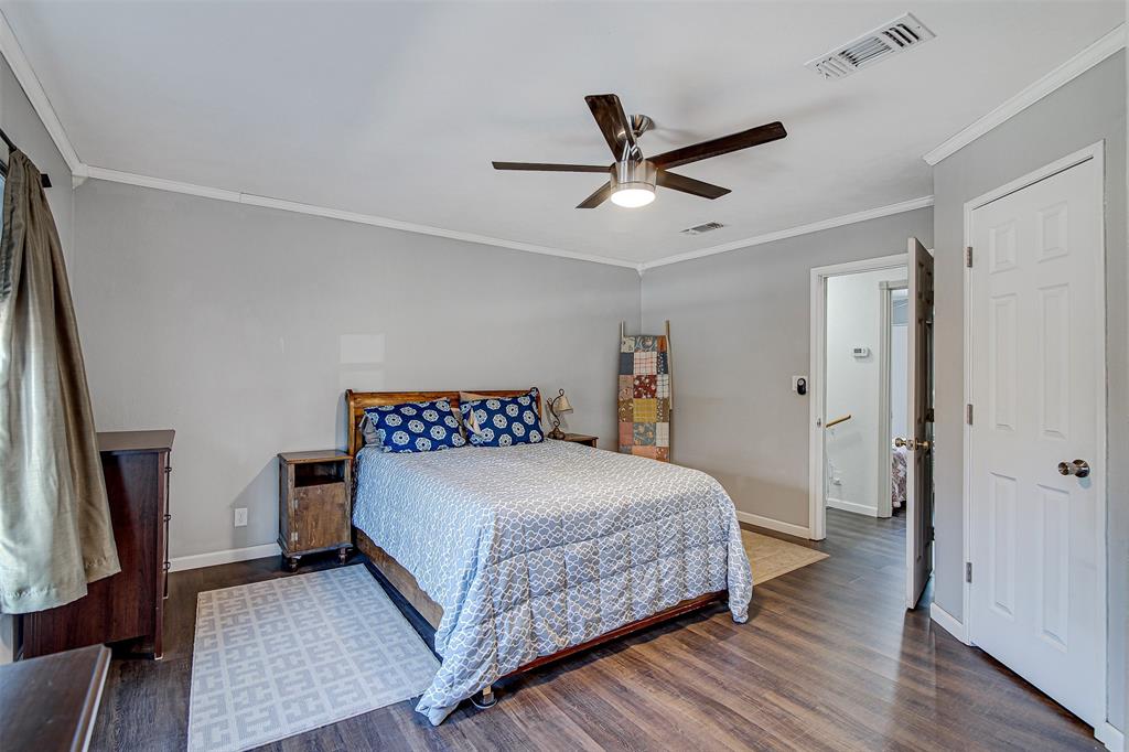 2521 Timber Road Burleson, TX 76028 - Photo 7 of 34 a bedroom with a bed and a large mirror