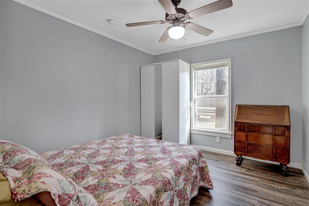 2521 Timber Road Burleson, TX 76028 - Photo 9 of 34 a bedroom with a bed and a window