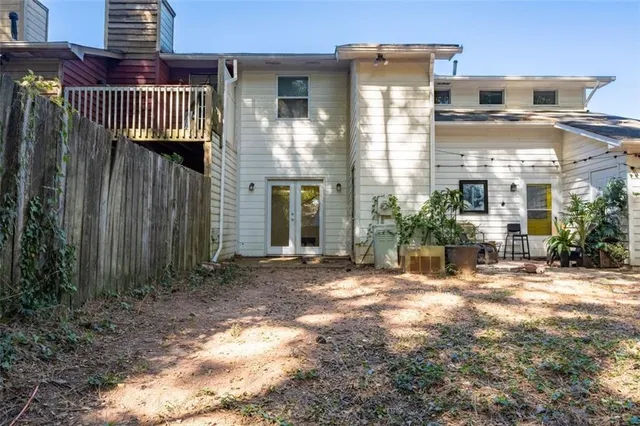 a view of a building with a door and wooden floor
