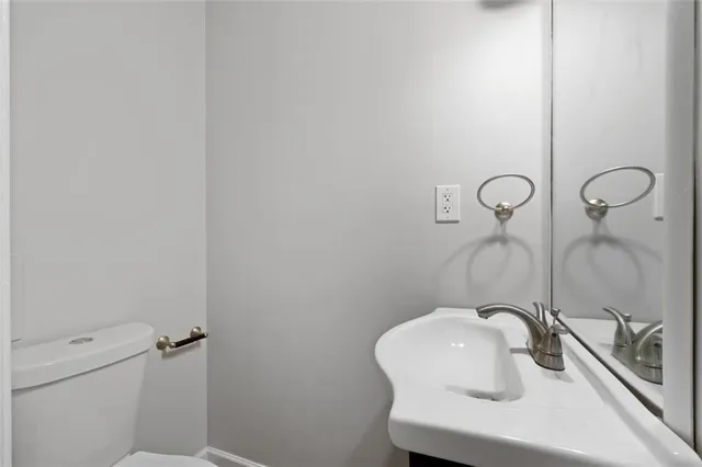a bathroom with a sink and toilet
