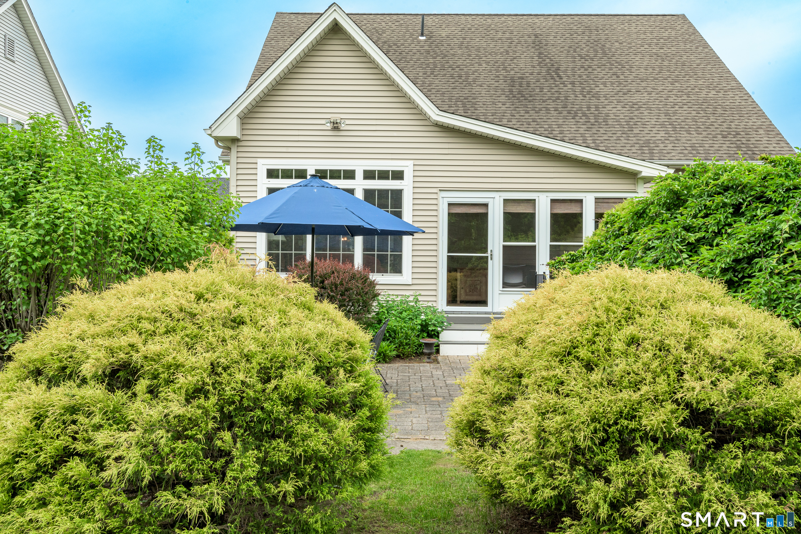 8 Greendale Drive, Unit 8 Suffield, CT 06078 - Photo 33 of 40 a front view of a house with garden