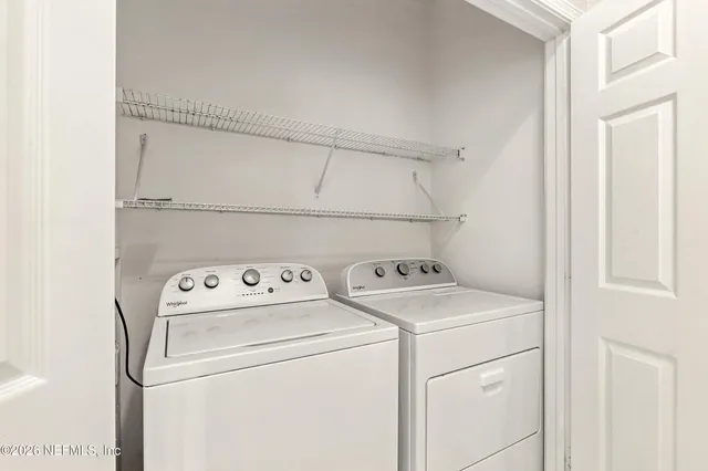 a utility room with dryer and washer