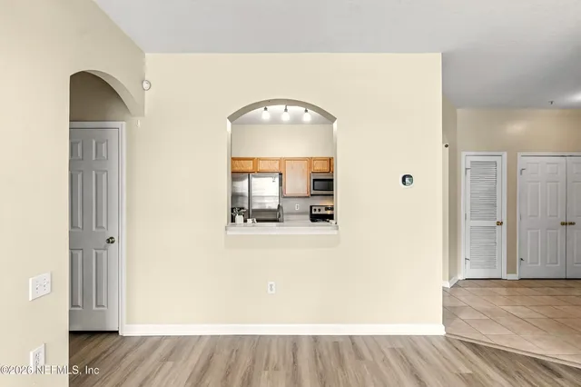 a view of a living room with wooden floor