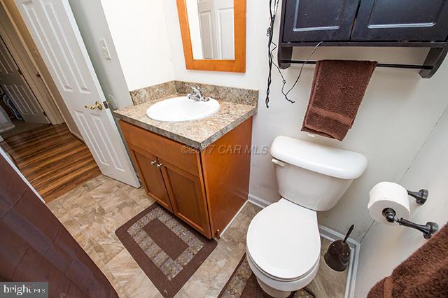 31403 Melson Road Delmar, MD 21875 - Photo 14 of 38 a white toilet sitting next to a bathroom sink