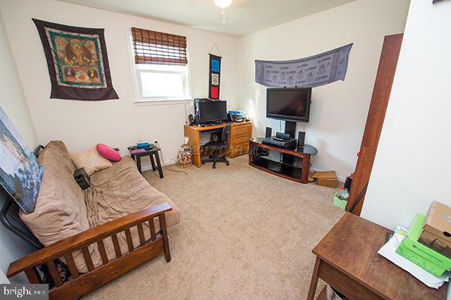 31403 Melson Road Delmar, MD 21875 - Photo 16 of 38 a living room with furniture and a flat screen tv