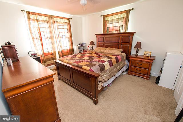 31403 Melson Road Delmar, MD 21875 - Photo 18 of 38 a bed sitting in a bedroom next to a window