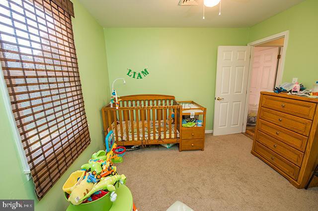 31403 Melson Road Delmar, MD 21875 - Photo 21 of 38 a bedroom with a bed and a dresser