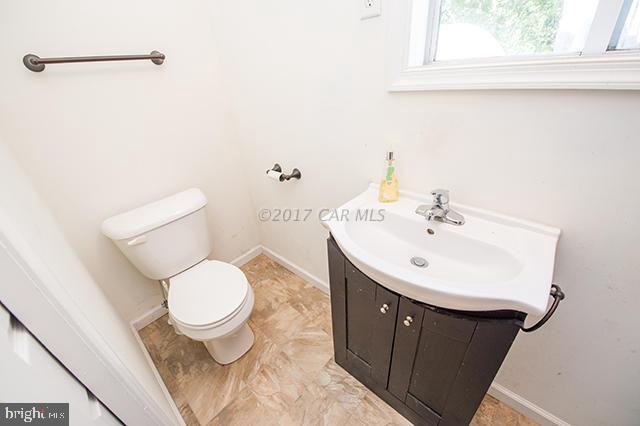 31403 Melson Road Delmar, MD 21875 - Photo 23 of 38 a bathroom with a sink toilet and a mirror