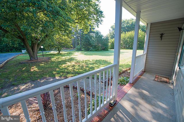 31403 Melson Road Delmar, MD 21875 - Photo 27 of 38 a view of a porch with a yard