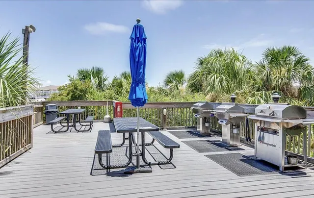a view of a swimming pool with outdoor seating