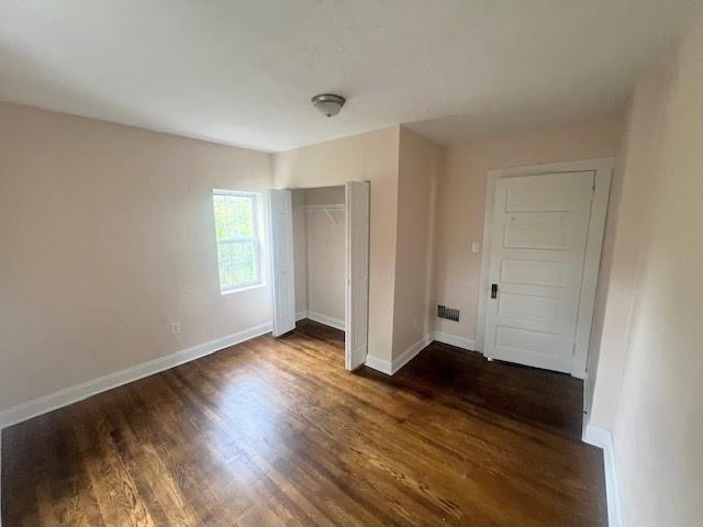 358 Pointview Road Pittsburgh, PA 15227 - Photo 11 of 12 an empty room with wooden floor and windows