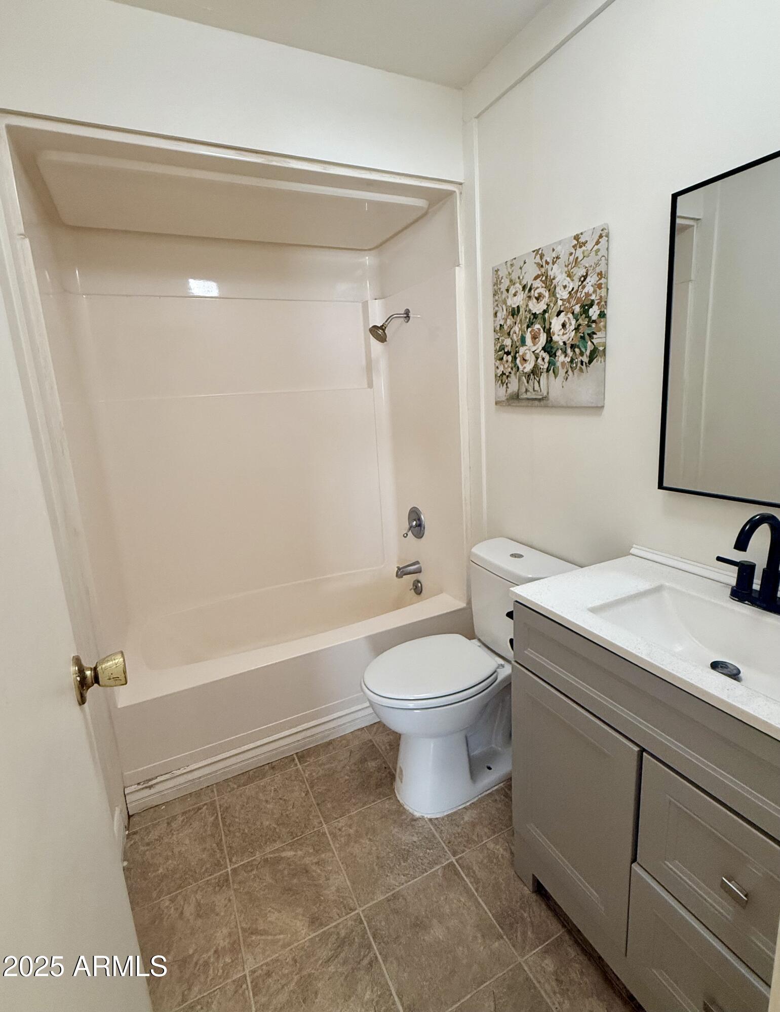 150 West North Street Ajo, AZ 85321 - Photo 16 of 37 a bathroom with a toilet a sink and bathtub