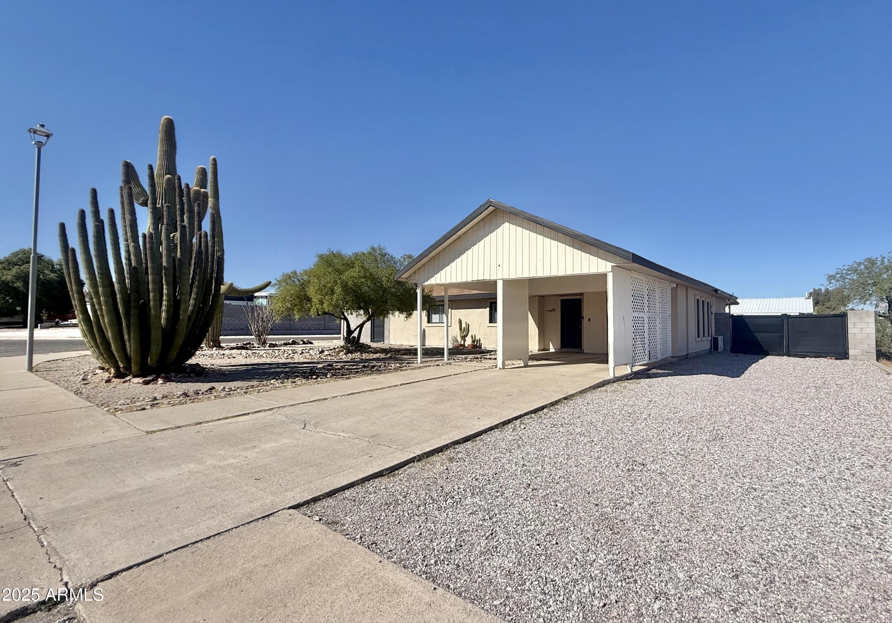 150 West North Street Ajo, AZ 85321 - Photo 2 of 37 a view of a house with backyard and plants