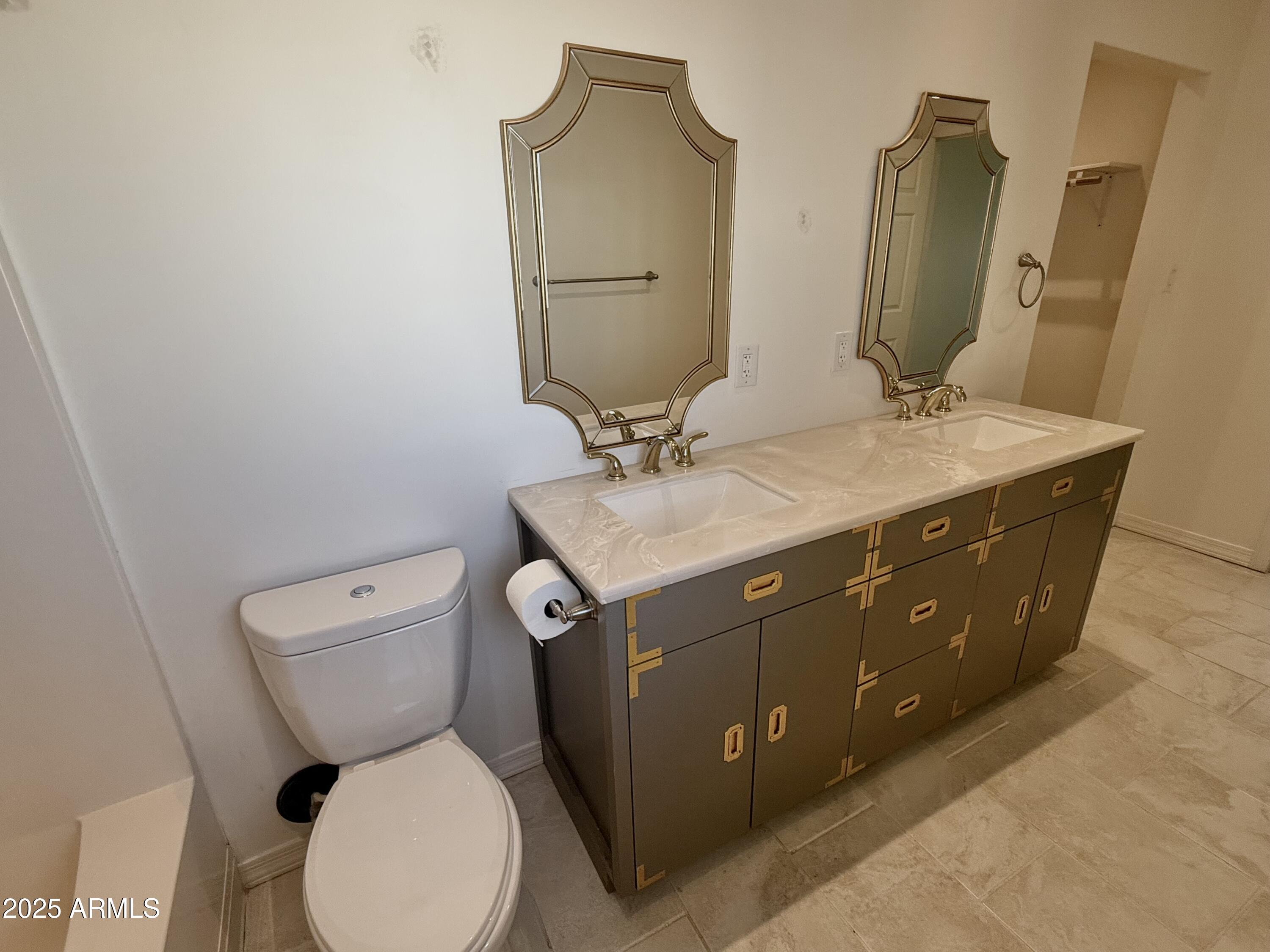 150 West North Street Ajo, AZ 85321 - Photo 24 of 37 a bathroom with double vanity sink and mirror
