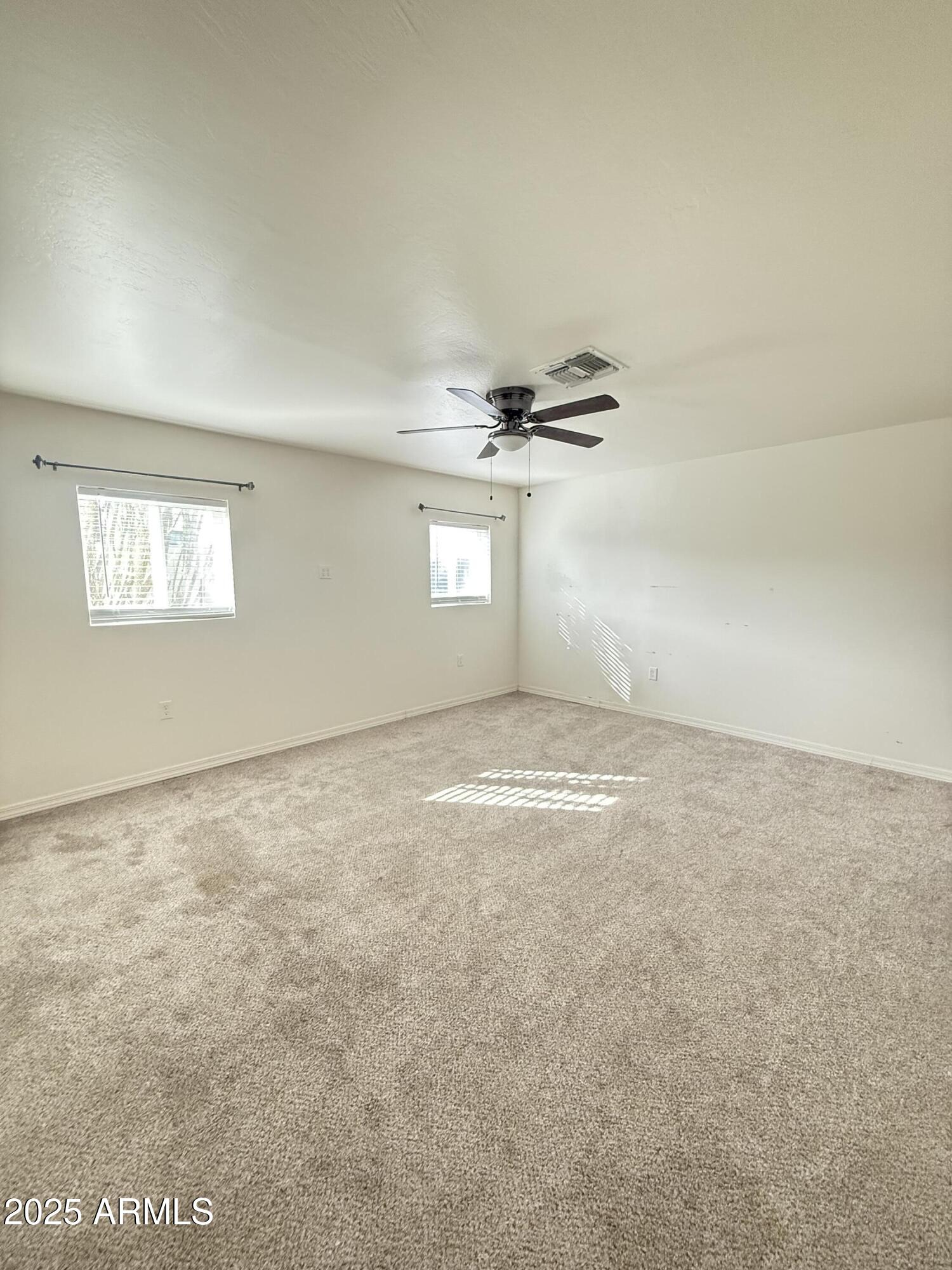150 West North Street Ajo, AZ 85321 - Photo 28 of 37 an empty room with a empty space and windows