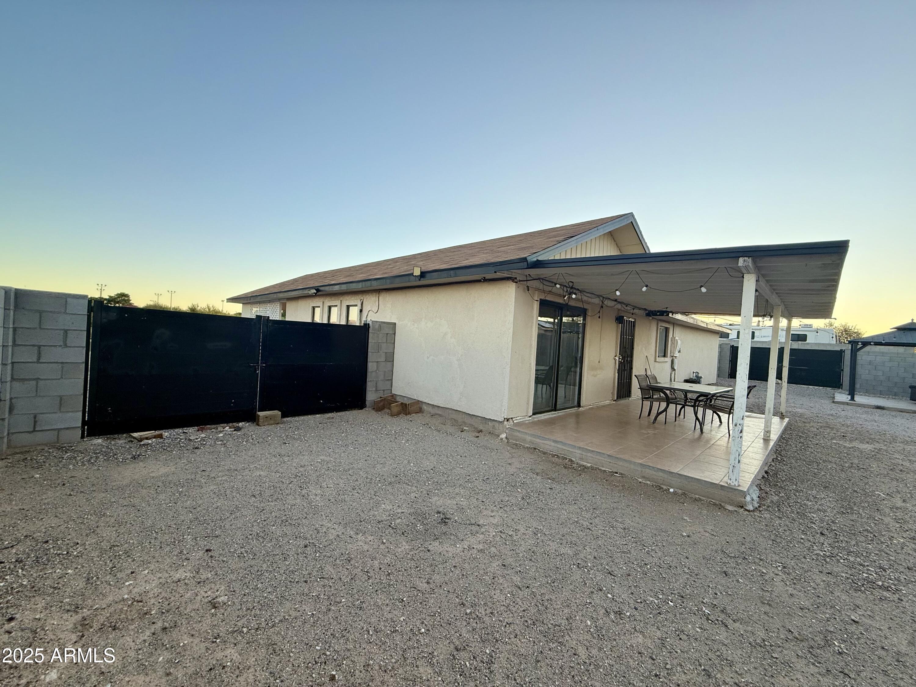 150 West North Street Ajo, AZ 85321 - Photo 29 of 37 a view of the house with backyard and sitting area