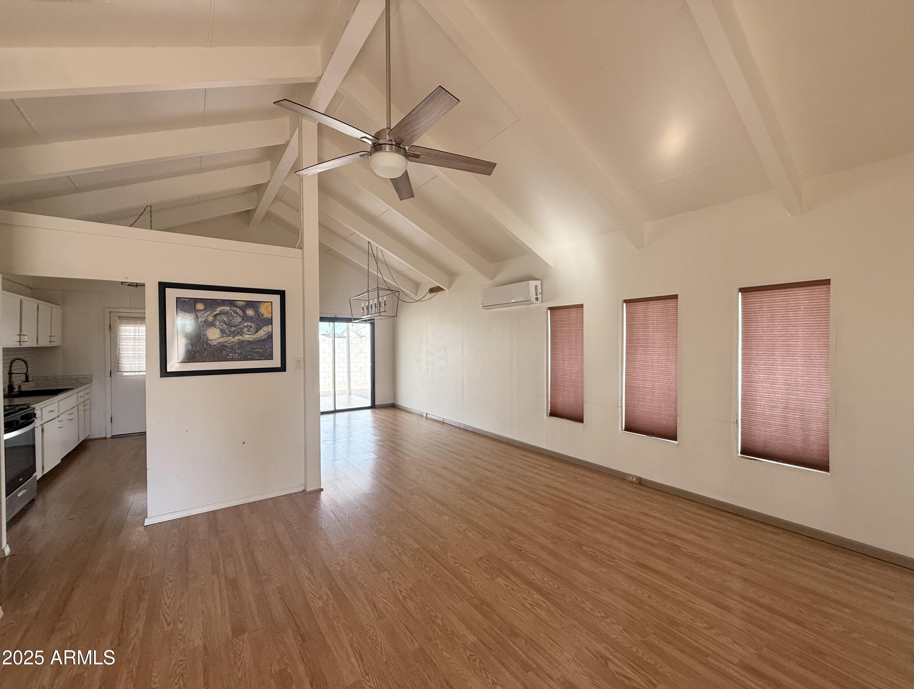 150 West North Street Ajo, AZ 85321 - Photo 6 of 37 a view of an empty room with a window and wooden floor