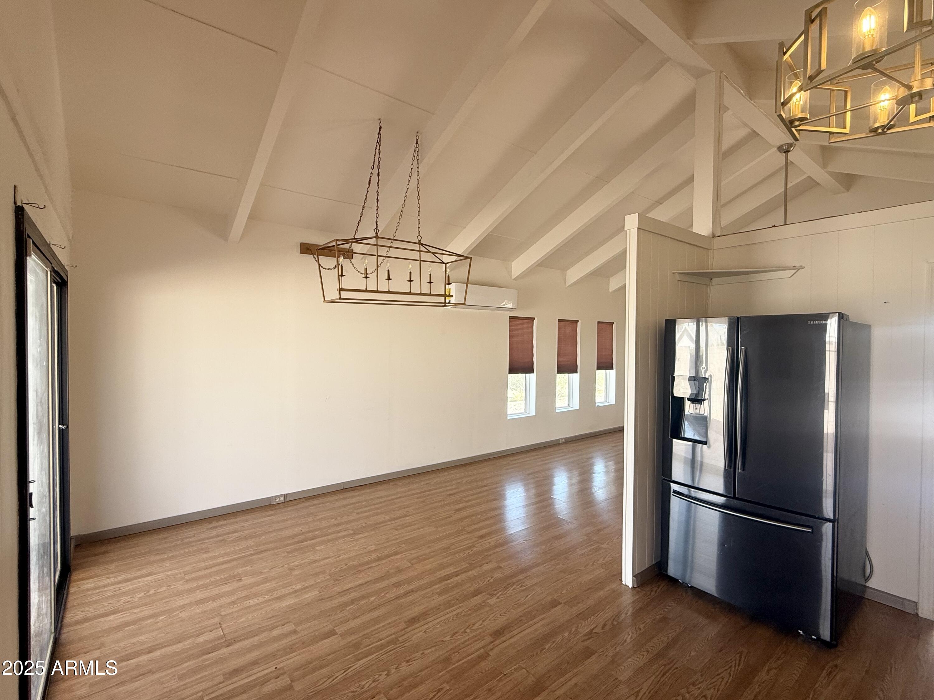 150 West North Street Ajo, AZ 85321 - Photo 8 of 37 a view of kitchen with stainless steel appliances wooden floor and staircase
