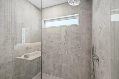 a bedroom with a bed and a chair