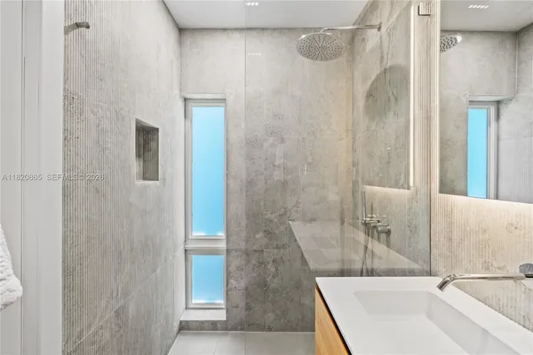 a view of a patio with a table and chairs under an umbrella