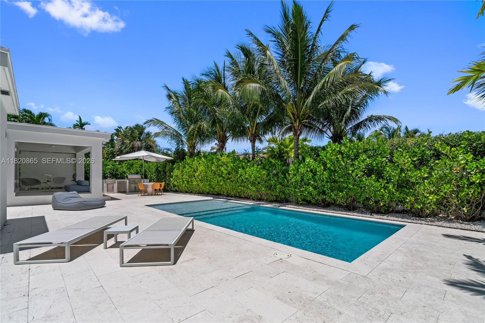 9033 Emerson Avenue Surfside, FL 33154 - Photo 34 of 40 a view of a backyard with a patio