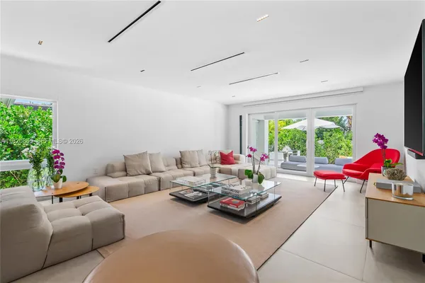 a kitchen with stainless steel appliances a stove a sink and a microwave