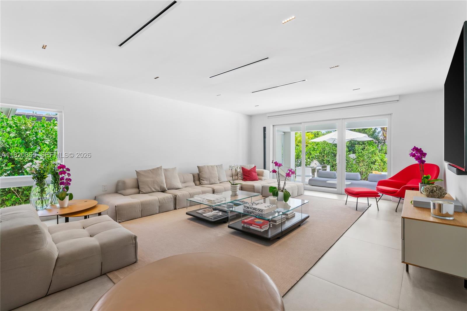 9033 Emerson Avenue Surfside, FL 33154 - Photo 9 of 40 a living room with furniture and a large window