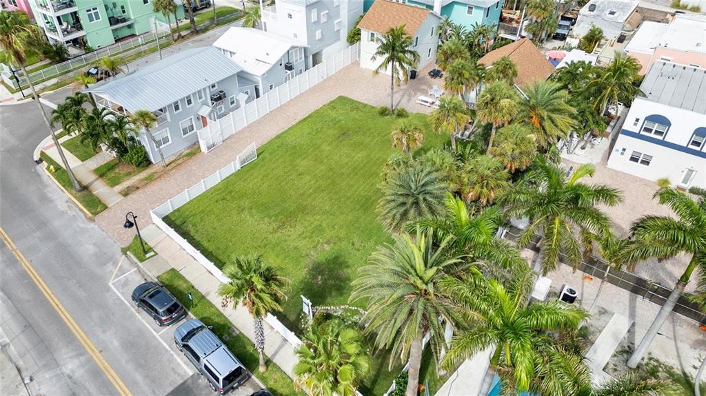 702 Pass A Grille Way St. Pete Beach, FL 33706 - Photo 10 of 41 an aerial view of a house with a yard and trees