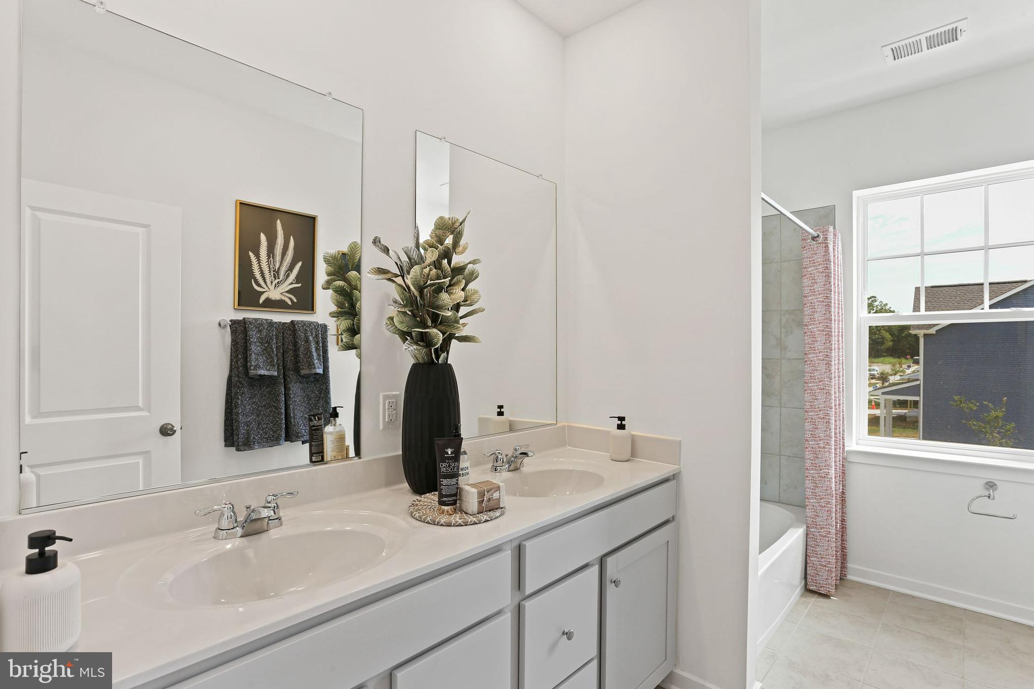 400 Silver Birch Drive Ranson, WV 25438 - Photo 13 of 15 a bathroom with a granite countertop sink and a mirror