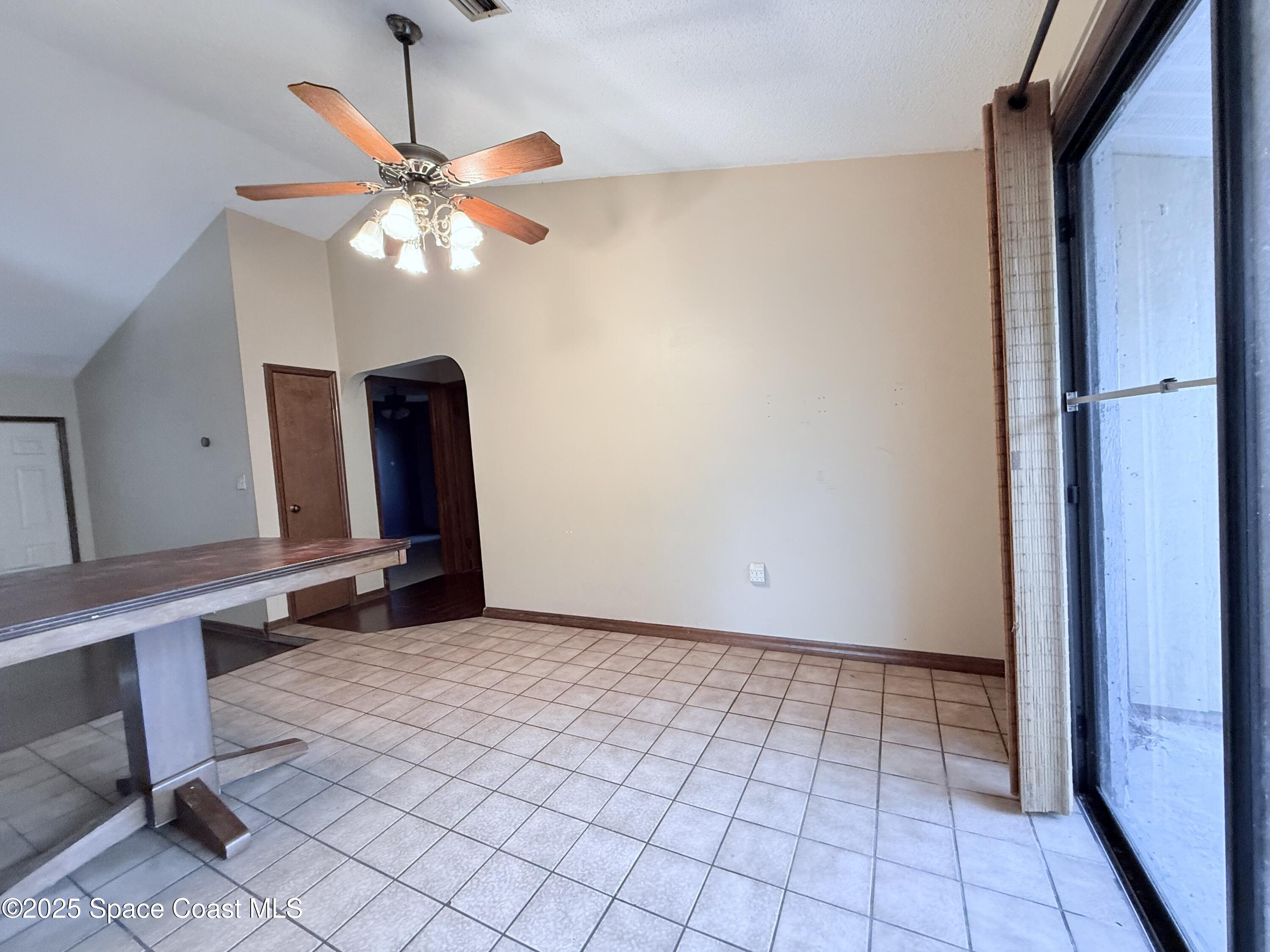 6180 Balboa Street Cocoa, FL 32927 - Photo 11 of 44 a view of an empty room with a window