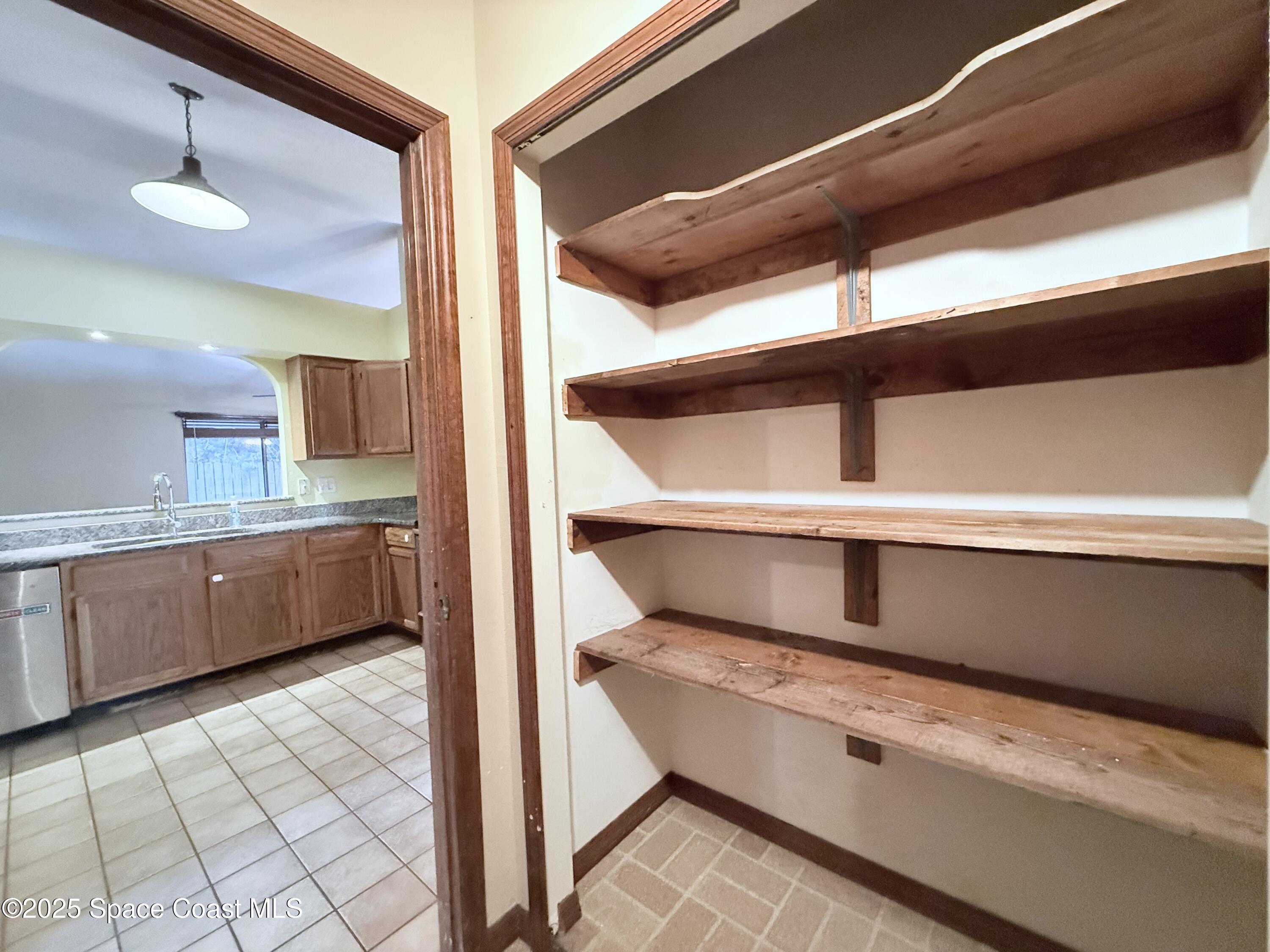 6180 Balboa Street Cocoa, FL 32927 - Photo 18 of 44 a view of hotel and kitchen