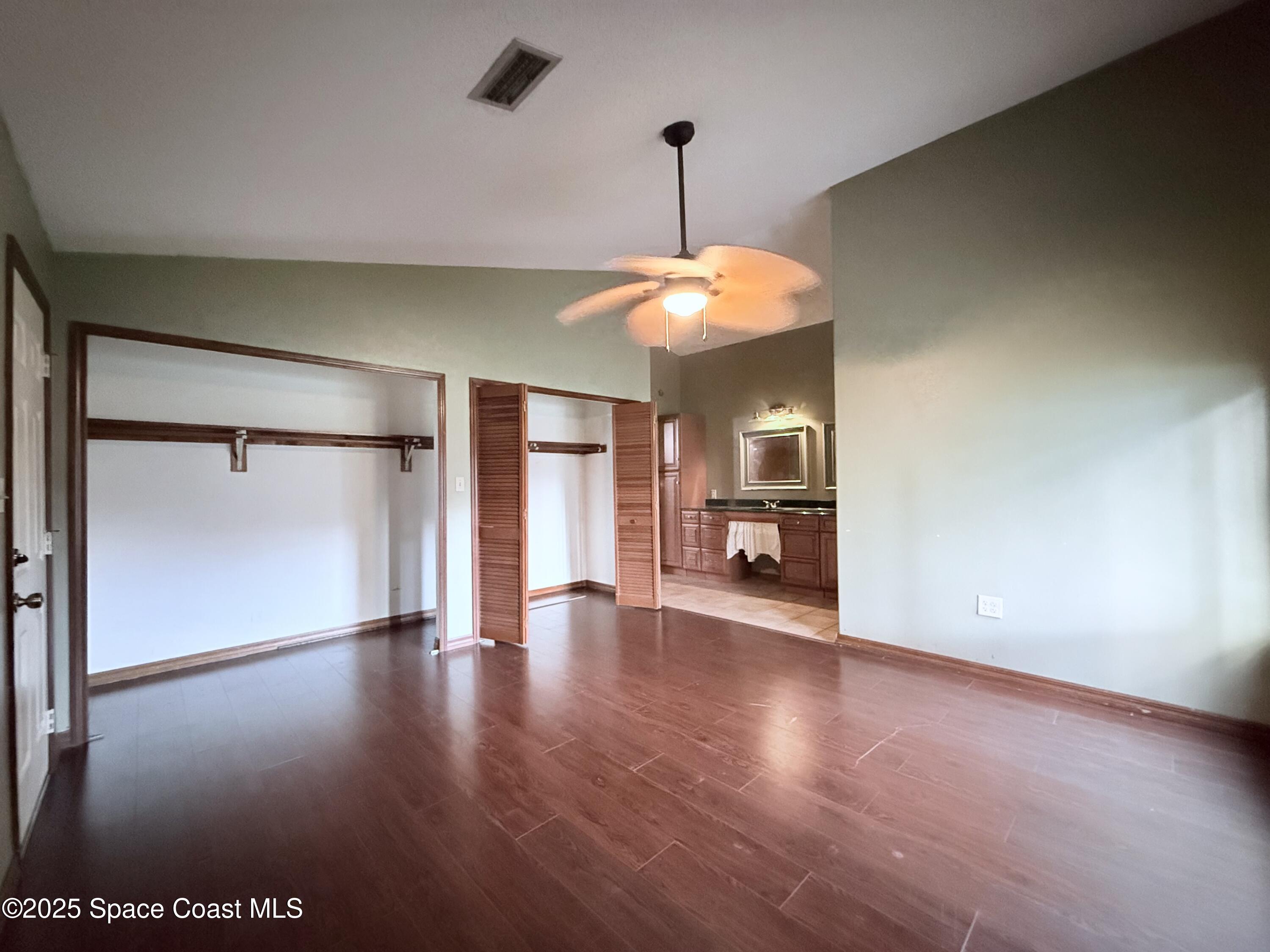 6180 Balboa Street Cocoa, FL 32927 - Photo 21 of 44 a view of an empty room with window and wooden floor