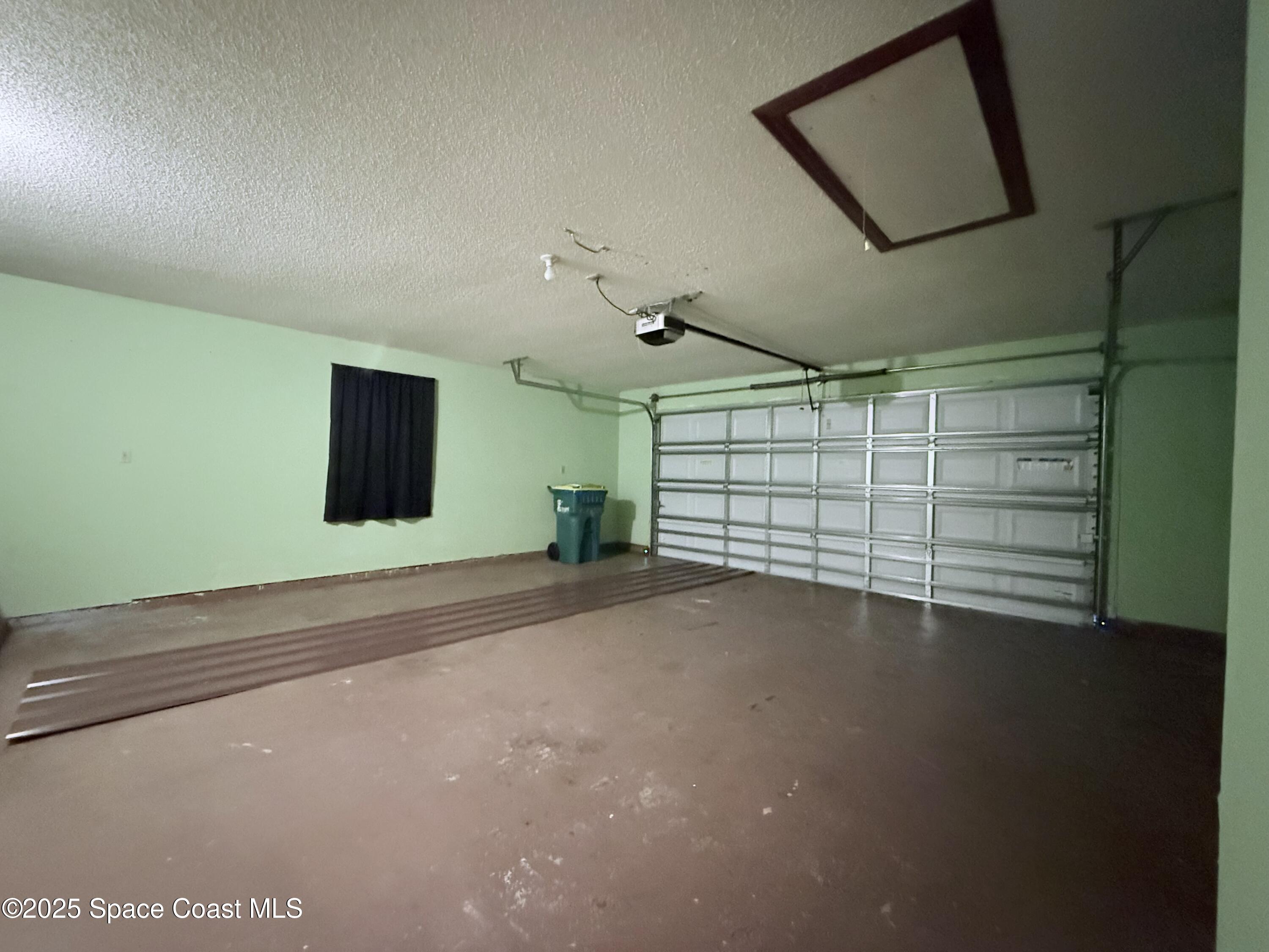 6180 Balboa Street Cocoa, FL 32927 - Photo 30 of 44 a view of a garage