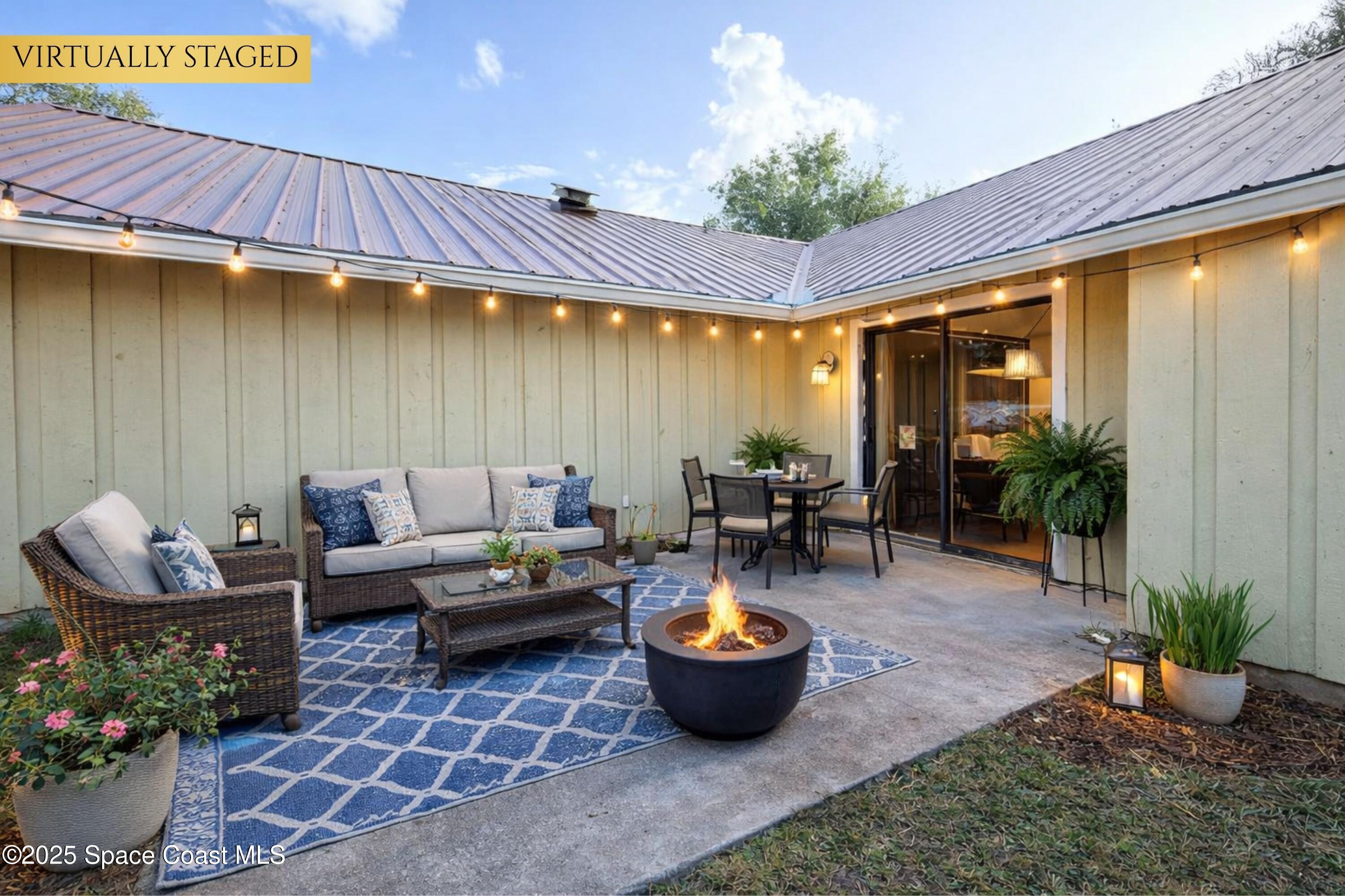 6180 Balboa Street Cocoa, FL 32927 - Photo 33 of 44 a outdoor space with patio couches and a potted plant