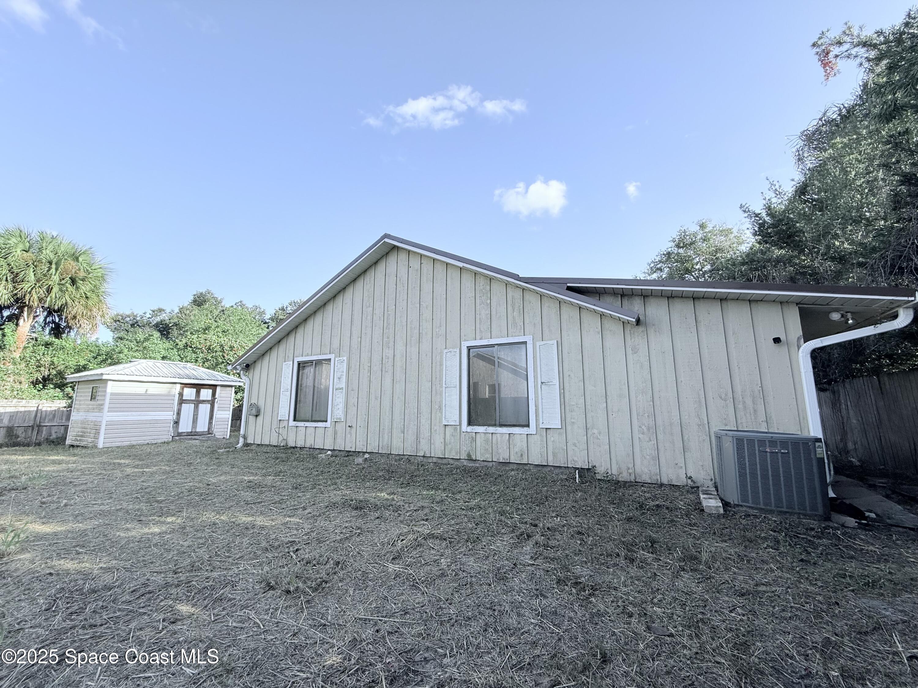 6180 Balboa Street Cocoa, FL 32927 - Photo 40 of 44 a backyard of a house