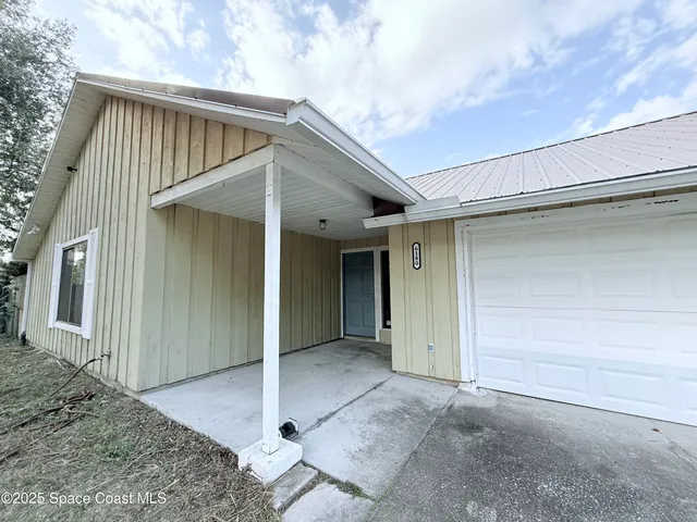 a view of backyard of garage